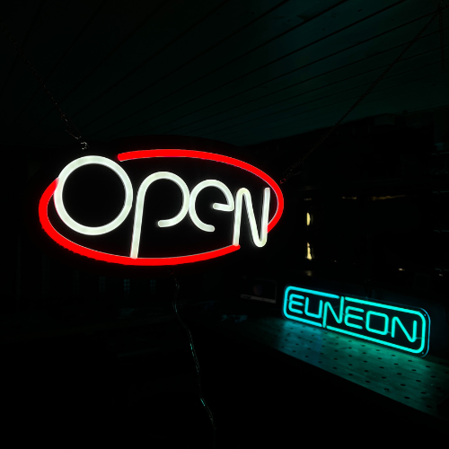 Open LED neon sign in red and white oval design for businesses